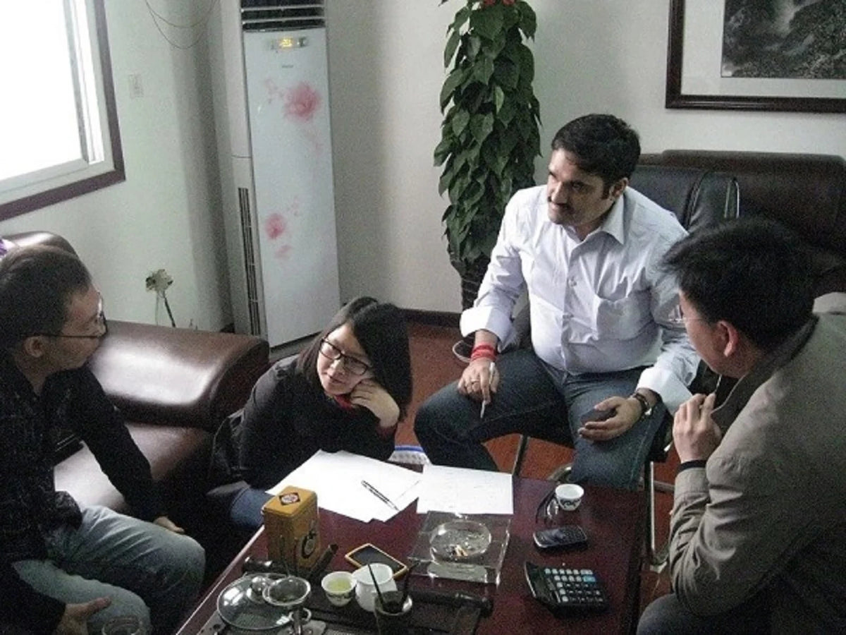 Client reviewing a screen project with the factory team