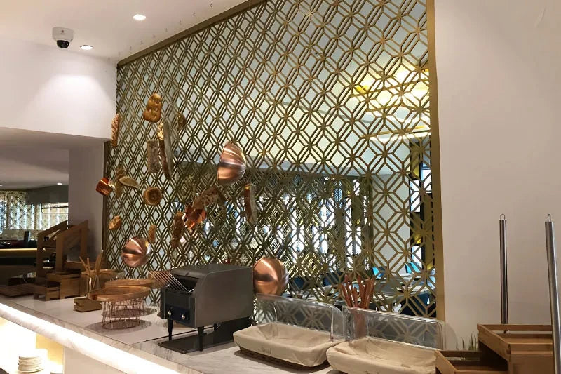 Our laser-cut stainless divider used to separate an open-plan office.