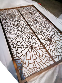 Close-up of our stainless screen detail with framed circular openings.