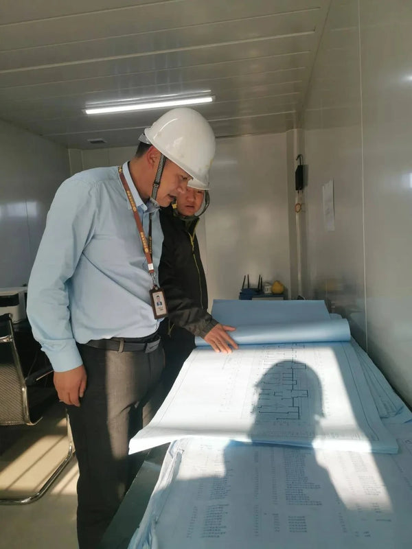 Engineer reviewing stainless screen shop drawings