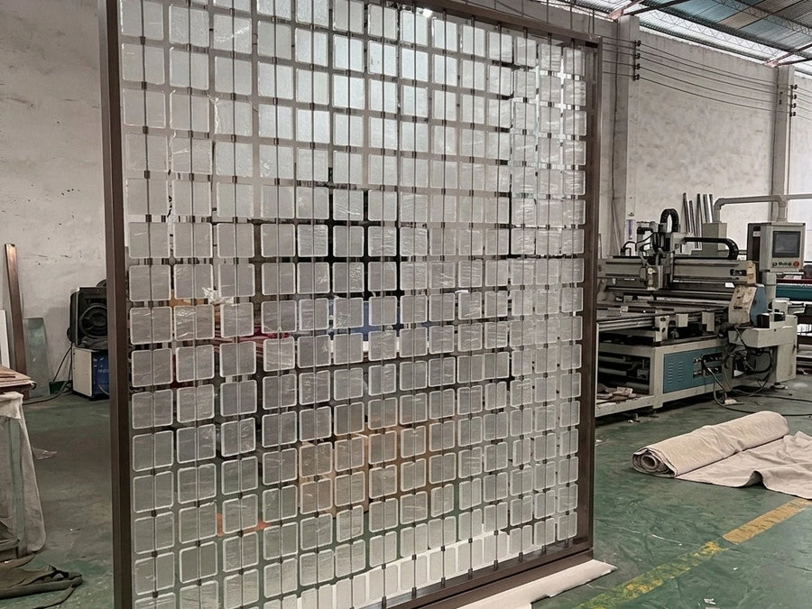 Fluted glass and stainless frame transition detail