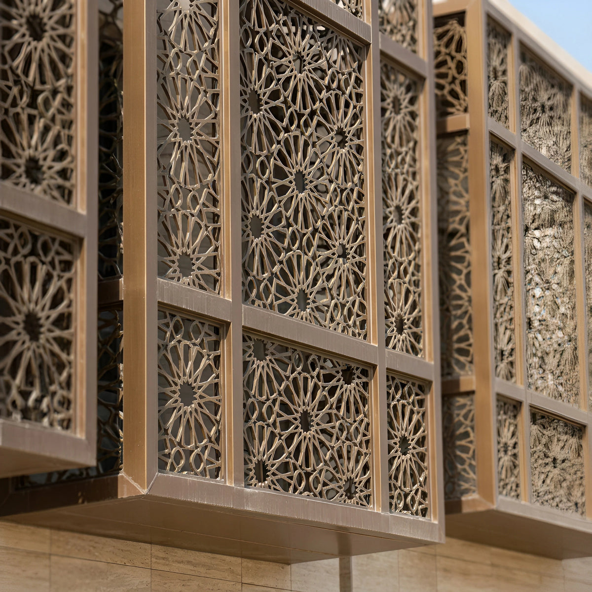 Architectural exterior metal screen defining an open outdoor boundary around a commercial landscape.