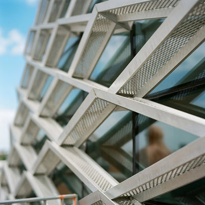 Geometric courtyard screen creating a focal outdoor boundary.